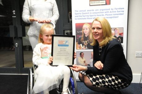 Katie Ress receiving Farnham Sports Council Award from Emma Das